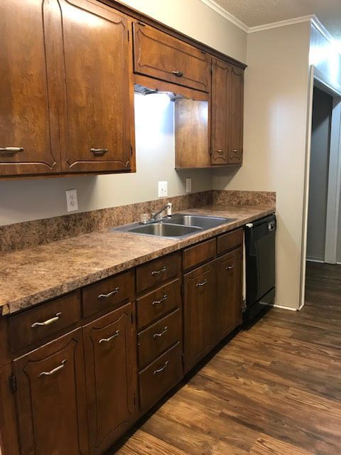 Apartment kitchen with cabinets and sink